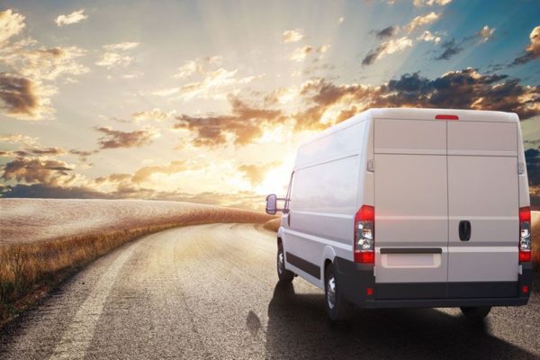 commercial van driving into the sunset